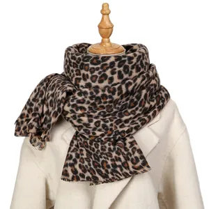 Classic leopard print pashmina scarf with fringes on a mannequin for autumn winter