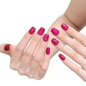 Magenta cat eye press-on nails with glitter accents and short square oval shape design
