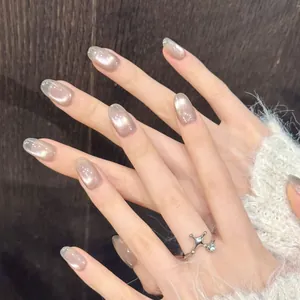 Champagne cat eye press-on nails with long oval shape and sparkling starlight finish