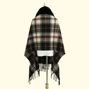 Detail of faux fur collar and plaid pattern on back of soft cashmere-feel tassel shawl