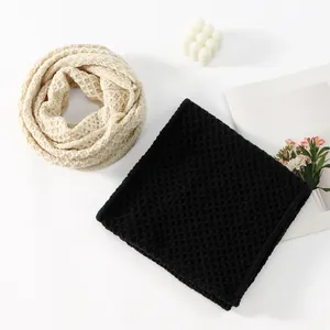 Chunky corn knit infinity scarf in cream and black for winter warmth and style