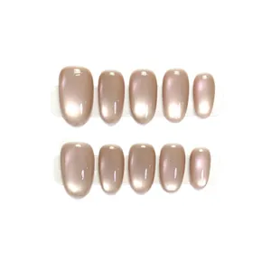 Short round press-on nails in nude champagne cat eye glass finish, 10-piece set