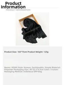 Detailed view of black snakeskin pattern scarf with dimensions 165x32.5cm and soft texture