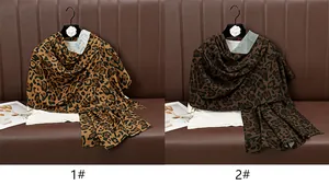 Detail comparison of two leopard print scarves in classic yellow-brown and coffee shades