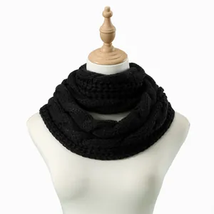 Detailed close-up showing the premium cable knit texture of the black infinity scarf