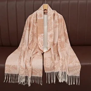 Faux cashmere shawl with autumn leaf jacquard patterns and tassels on a wooden hanger