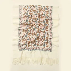 Detailed embroidery of ginkgo floral patterns on a beige cashmere-feel winter scarf