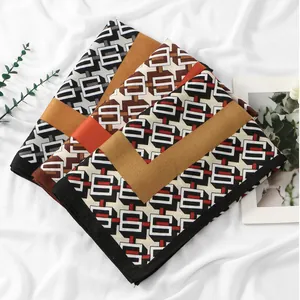 Lightweight autumn printed scarf with geometric patterns in rust red and brown tones