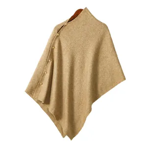 Chic camel knit poncho shawl with side gold buttons and elegant diagonal neckline