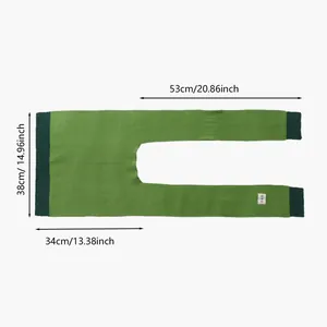 Flat lay of green houndstooth knit shawl with dimensions and woven geometric label