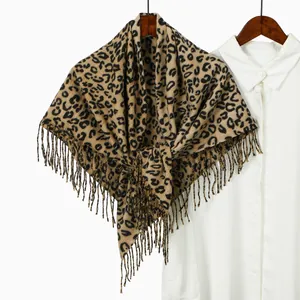 Fashionable leopard print cashmere feel square scarf with fringes hanging on hanger