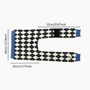 Detail view of houndstooth knit shawl with precise dimensions and blue ribbed edges