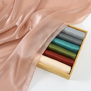 Ethnic style shimmer long shawl with sheer texture and multi-color fabric rolls in wooden box