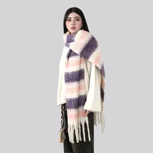 Close-up of thick pastel purple and pink striped scarf with soft fringe details