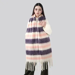Detail of long thick scarf with purple and beige stripes and long tassel trim