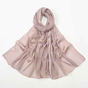 Detail of dusty pink chiffon shawl with vertical satin stripes and neat hemmed edges