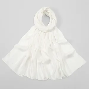 Detail of white cotton-linen feel scarf with elegant vertical striped texture design