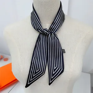 Close-up of navy and white striped twilly scarf showing fabric texture and care label