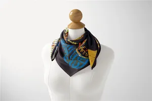 Detail of artistic silk scarf with abstract patterns draped on a white mannequin