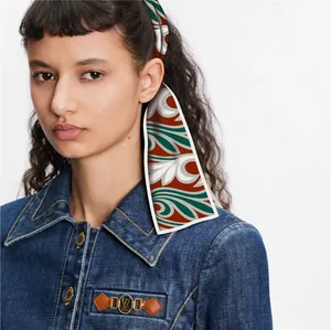 Elegant retro Dunhuang silk scarf headband tied in hair with vintage leaf patterns