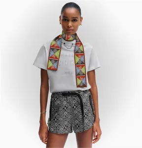 Dunhuang style geometric floral silk scarf twilly styled as a neckerchief for women