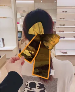 Artistic silk hair ribbon with Van Gogh sunflower print and elegant satin bow for women