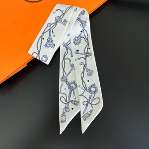 Silk feel twilly scarf with vintage key print on orange and black background