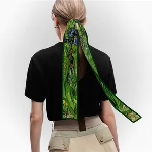 Silk-like floral scarf with Van Gogh iris print worn as a stylish hair tie for women
