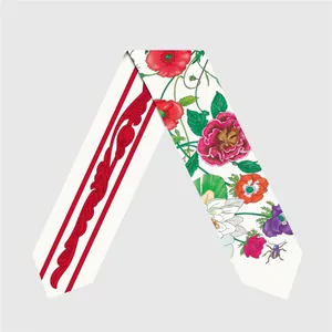 Detailed macro view showing the double-sided floral and vintage print of the long silk scarf