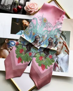 Detail of pink silk hair scarf with hand-painted tiger and tropical floral pattern