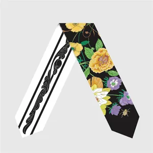 Detail showing double-sided floral and beetle print on a high-quality silk twilly scarf