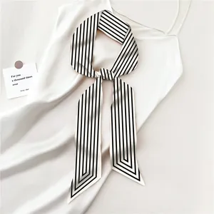 Narrow silk scarf with black and white vertical stripes in a bow knot style
