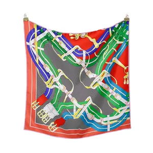 Elegant equestrian style silk skinny scarf with vibrant orange and green horse motifs