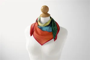 Detail of silk-like neck scarf with Van Gogh art print on a white mannequin model