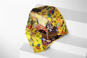 Close-up of Klimt Lady with a Fan silk scarf featuring vibrant yellow satin texture