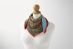 Detail view of Monet oil painting floral print silk scarf tied on a white model neck