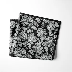Classic black and white paisley silk pocket square in a stylish folded arrangement
