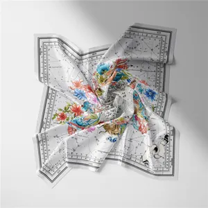 Detailed view of luxury silk scarf with vintage astrological motifs and satin finish