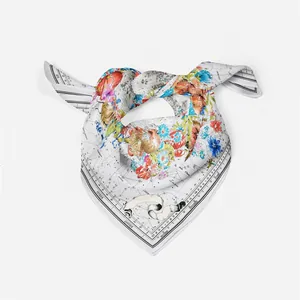 Close-up of premium silk scarf with fine French astrological and floral patterns