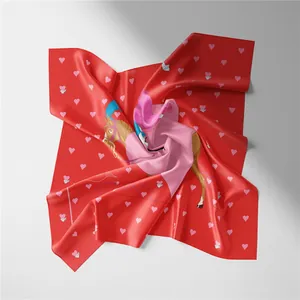 Detail of red silk square scarf with pink hearts and artistic horse illustration
