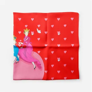 Detail of red silk scarf showing royal tea time illustration and heart patterns