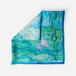 Detailed close-up of silk square scarf featuring Monet's Water Lilies and willow pattern