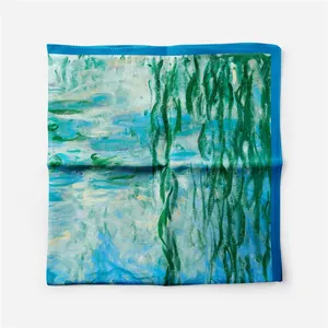Detailed macro view of Monet Water Lilies silk scarf with vibrant blue hand-rolled edges