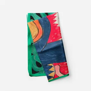 Close-up of artistic silk scarf with landscape print and premium twill texture detail
