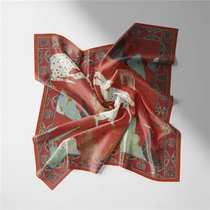 Macro detail of red silk scarf showing elegant white horse print and vintage floral borders