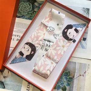 Pink silk twilly scarf with cartoon girl and daisy print in an orange gift box