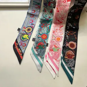 Macro view of four assorted floral patterns on silk-like twilly ribbons and headbands