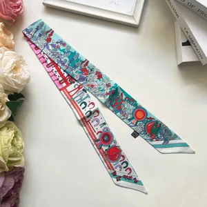 Detail of floral silk scarf twilly with elegant flower print and wavy pattern edges