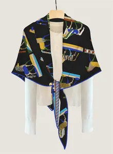 Detail of luxury silk scarf with equestrian horse print over white shirt on wooden hanger