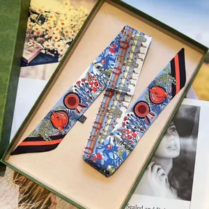 Floral twilly silk scarf in blue with luxury green textured gift box and washing label detail